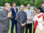President Droupadi Murmu being greeted by Himachal Pradesh Governor Kavinder Gupta, left, along with state Chief Minister Sukhvinder Singh Sukhu, center, during her visit to Himachal Pradesh, in Shimla, on Friday. (PTI)