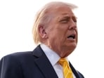 President Donald Trump talks to reporters before he boards Air Force One at Palm Beach International Airport in West Palm Beach, Florida.
