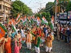 A celebration in the streets of West Bengal as supporters of various political parties gather with flags and drums ahead of the Assembly election results 2026. (AI generated)