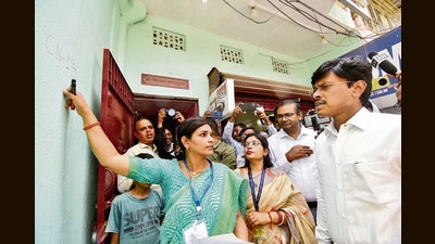 An enumerator staff marks a house with Patna DM Tyagrajan SM during the first phase of Census 2027, at Danapur Ramji Chak, in Patna, Saturday (SANTOSH KUMAR/HT)
