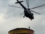 A risky reel stunt on a 60-foot tank ends in death and injuries in UP, prompting a dramatic IAF airlift rescue of stranded teens. (Screengrab)