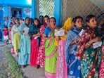 Voters stand in a queue to cast their vote during re-polling for the West Bengal Assembly elections at Magrahat Paschim Bidhan, in South 24 Parganas.