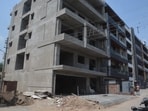 An under-construction Stilt+4 structure in Sector 11, Panchkula. The sentiment is that the city’s vintage design —engineered for single-unit housing — is buckling under vertical expansion. (Sant Arora/HT)