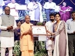 CM Yogi Adityanath distributed appointment letters to 252 dental hygienists and 357 junior analysts (drugs) during an event in Lucknow on Sunday. (HT)