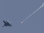 An Israeli F15 jet releases a flare while flying over southern Lebanon, near the Israel-Lebanon border, as seen from the Israeli side of the border in northern Israel, April 13, 2026.