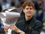 Italy's Jannik Sinner celebrates with the trophy after winning the 2026 ATP Tour Madrid Open. (AFP)