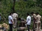 Police personnel at the spot in Manimajra where the body of Krishan Kumar was found on Saturday. (Sant Arora / HT)