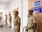 Police personnel stand guard at the strong room set up at Queen Mary's College, in Chennai. (ANI) Police personnel stand guard at the strong room set up at Queen Mary's College, in Chennai. (ANI)