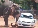 The elephant was seen lifting and flipping a car.