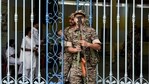 Security personnel stand guard outside the strong room of Khudiram Anushilan Kendra on the eve of counting and results of the West Bengal Assembly polls, in Kolkata(PTI)