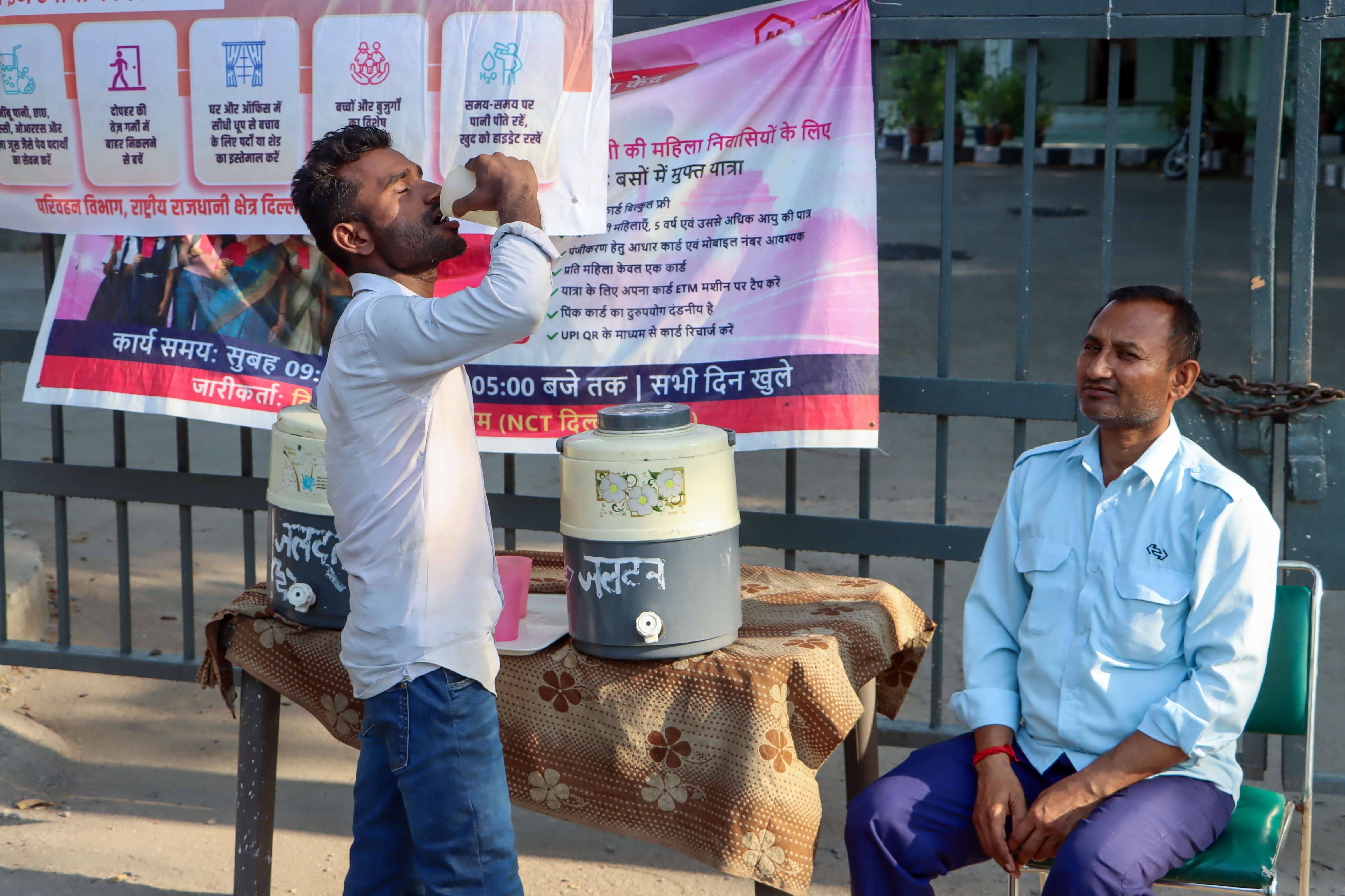 A man drinks water from a Delhi government initiative, the Heat Wave Action Plan, amid rising temperatures to put drinking water near the Ambedkar Stadium Bus Stand in New Delhi. (Sathiya ) A man drinks water from a Delhi government initiative, the Heat Wave Action Plan, amid rising temperatures to put drinking water near the Ambedkar Stadium Bus Stand in New Delhi. (Sathiya )