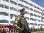 A security official stands guard outside the civil secretariat during the annual ‘darbar move’, in Srinagar on Monday. Darbar move offices reopen in Srinagar after six months in Jammu, as the government shifts its base for the summer. (PTI Photo)