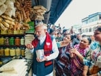 Prime Minister Narendra Modi eats Jhalmuri snack on the sidelines of the election rallies for West Bengal Assembly elections 2026, in Jhargram.
