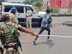  Security personnel resort to a lathi charge as a scuffle turns into a clash near a counting centre.