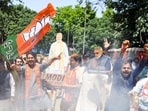 BJP supporters celebrate the party's majority in West Bengal, Assam, and Puducherry on the counting day of the Assembly Elections 2026, in New Delhi. 