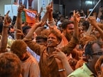 BJP workers and supporters in Kolkata celebrate the party’s success in the Bengal assembly elections on Monday. (AFP)