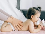A calm moment between parent and baby during a gentle massage.