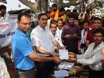 DM and SSP Mathura at a boat registration camp at Kesi Ghat in Vrindavan. (HT Photo)