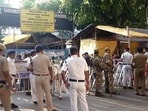 Security personnel and officials outside a vote counting centre during the West Bengal Assembly election results day, in Kolkata. Security personnel and officials outside a vote counting centre during the West Bengal Assembly election results day, in Kolkata.