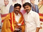 File photo of Saminathan  with TVK chief Vijay.