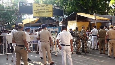 Security personnel and officials outside a vote counting centre during the West Bengal Assembly election results day, in Kolkata. (PTI) Security personnel and officials outside a vote counting centre during the West Bengal Assembly election results day, in Kolkata. (PTI)
