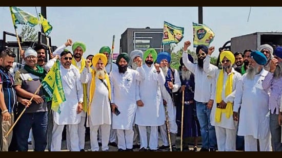 Members of the Azad Kisan Morcha during the stir at the Ladhowal toll plaza in Ludhiana on Monday. (HT PHOTO)