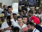 Chennai: Tamilaga Vettri Kazhagam (TVK) chief and candidate from the Tiruchirappalli East constituency, Vijay, shows an election certificate outside a centre.