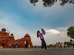 People enjoy the pleasant weather at Red Fort in New Delhi on Tuesday. (RAJ K RAJ /HT PHOTO)