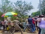 Security personnel police BJP and TMC supporters during an altercation in Bankura on Monday. (ANI Video Grab)