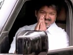 Tamilaga Vettri Kazhagam (TVK) President Vijay greets as he arrives at party headquarter, in Chennai on Tuesday. (ANI)