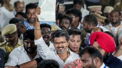 Chennai: Tamilaga Vettri Kazhagam (TVK) chief and candidate from the Tiruchirappalli East constituency, Vijay, shows an election certificate outside a centre. (PTI) Chennai: Tamilaga Vettri Kazhagam (TVK) chief and candidate from the Tiruchirappalli East constituency, Vijay, shows an election certificate outside a centre. (PTI)