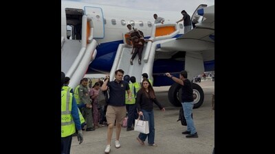 Passengers being evacuated via inflatable slides at Chandigarh airport on Tuesday.