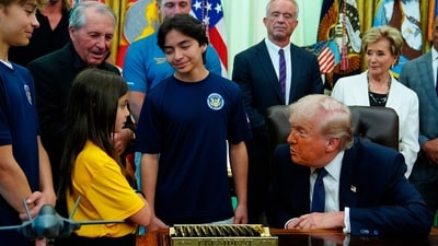 President Donald Trump speaks with children before signing a proclamation in the Oval Office at the White House, in Washington. (AP) President Donald Trump speaks with children before signing a proclamation in the Oval Office at the White House, in Washington. (AP)