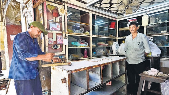 Mumbai, India - May 5, 2026: Shopkeppers and resident evacuate Haji Noorani Chawl at Prabhadevi, in Mumbai, India, on Tuesday, May 5, 2026. (Photo by Anshuman Poyrekar/Hindustan Times) (Anshuman Poyrekar/HT Photo)