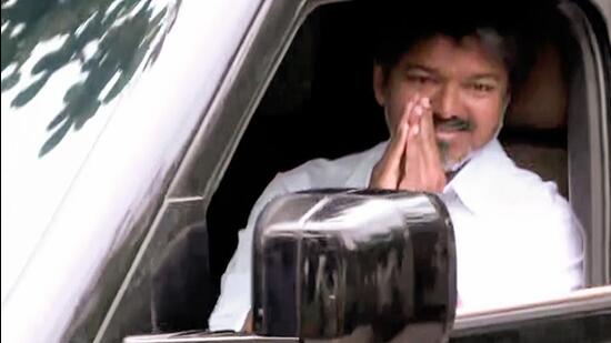 Tamilaga Vettri Kazhagam (TVK) President Vijay greets as he arrives at party headquarter, in Chennai on Tuesday. (ANI)