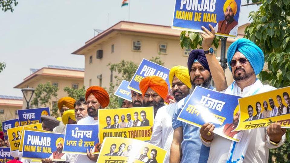 AAP MLAs holding up placards near Rail Bhawan in New Delhi on Tuesday. (PTI Photo) AAP MLAs holding up placards near Rail Bhawan in New Delhi on Tuesday. (PTI Photo)