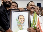 Kochi: Leader of Opposition in Kerala Assembly and Congress leader, VD Satheesan, receives a portrait by supporters, at DCC office in Kochi, Tuesday, May 5 (PTI)