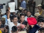 Tamilaga Vettri Kazhagam (TVK) chief and candidate from the Tiruchirappalli East constituency, Vijay, shows an election certificate outside a centre during vote counting for Tamil Nadu Assembly elections, in Chennai, Monday, May 4, 2026. 