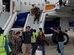 Passengers being evacuated via inflatable slides at Chandigarh airport on Tuesday.
