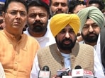 Punjab CM Bhagwant Mann along with AAP MLAs talking to mediapersons after meeting President Droupadi Murmu in New Delhi on Tuesday. (Vipin Kumar/ HT)