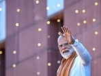 Bharatiya Janata Party (BJP) leader Narendra Modi waves to supporters as he arrives at party headquarters in New Delhi.