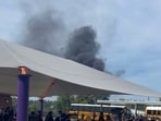 Smoke seen rising to the sky as firefighters battle the blaze in DeLand, Florida.