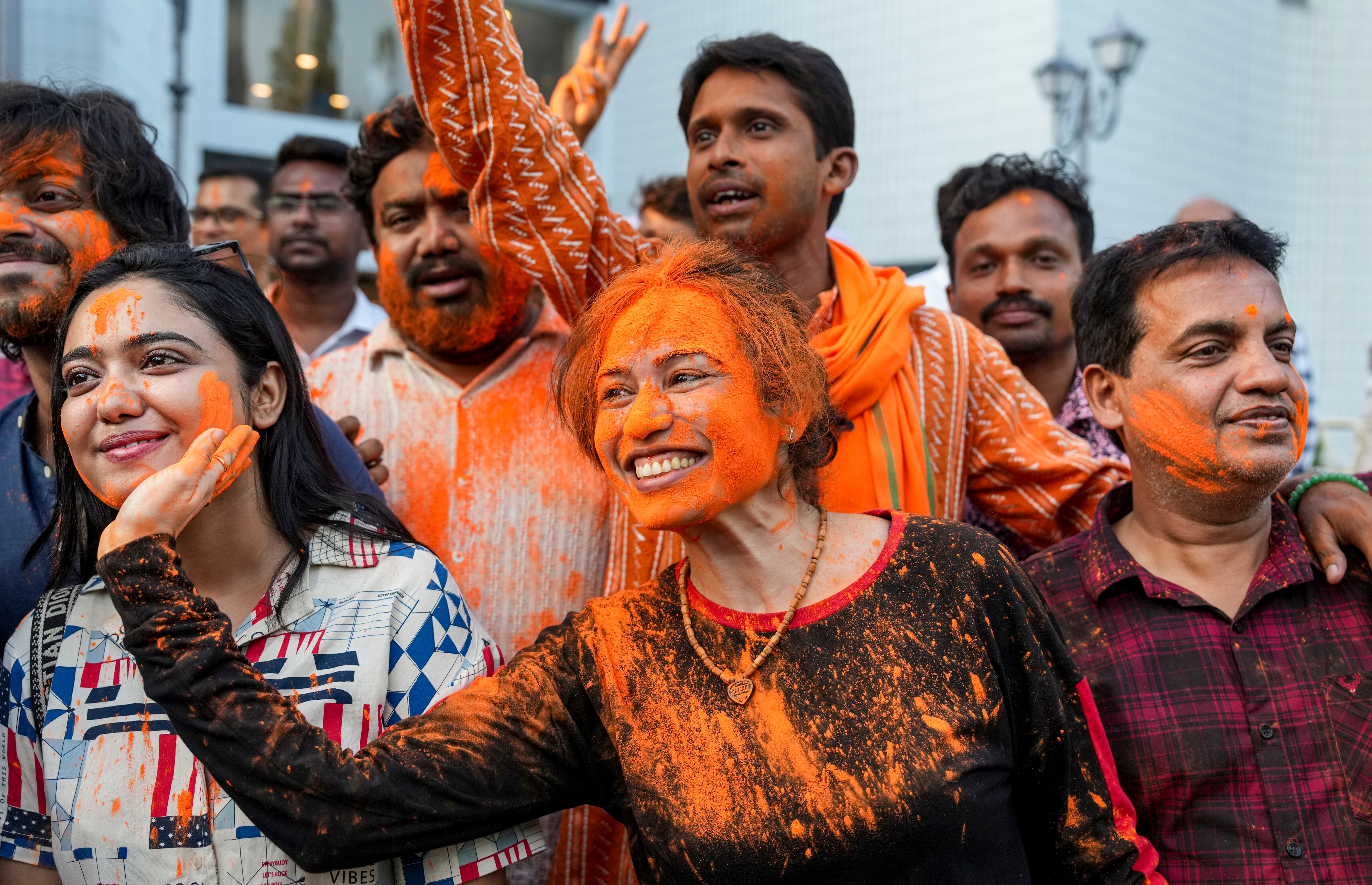 BJP activists smear colours on each other as they celebrate the party's win in the West Bengal Assembly elections. (PTI) BJP activists smear colours on each other as they celebrate the party's win in the West Bengal Assembly elections. (PTI)