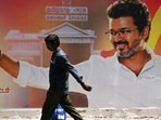 A man walks past a poster praising the victory of actor and Tamilaga Vettri Kazhagam (TVK) party president C. Joseph Vijay in Chennai on May 7, 2026 after the Tamil Nadu assembly election results were announced on May 4 (AFP) A man walks past a poster praising the victory of actor and Tamilaga Vettri Kazhagam (TVK) party president C. Joseph Vijay in Chennai on May 7, 2026 after the Tamil Nadu assembly election results were announced on May 4 (AFP)