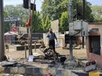 An investigator at the blast site outside the Punjab Frontier headquarters of the Border Security Force (BSF) in Jalandhar on Wednesday. (HT Photo)