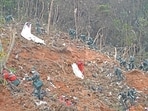 Rescuers search for the black boxes at a plane crash site in Tengxian county of Wuzhou, Guangxi Zhuang Autonomous Region in China on March 22, 2022.