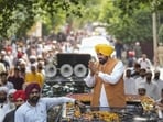Chief minister Bhagwant Mann greeting supporters during his Shukrana Yatra in Jalandhar on Thursday. (HT Photo)