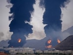 Plumes of smoke and fire rise after debris from an intercepted Iranian drone struck an oil facility, according to authorities, in Fujairah, United Arab Emirates, March 14.