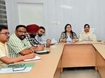 Mayor Inderjit Kaur and MC commissioner Neeru Katyal Gupta during a meeting at MC Zone A office on Wednesday. (HT PHOTO)