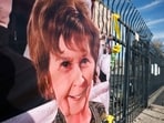 A photograph of Nancy Guthrie is displayed on a banner in front of the KVOA television station on March 01, 2026 in Tucson, Arizona. 